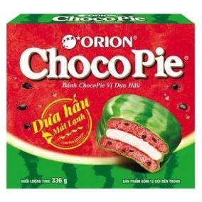 Twice as Sweet Orion Choco Pie Watermelon 12 Pack (Vietnam) features chocolate-coated cakes with pink filling and cake, plus a watermelon graphic on bright green and red packaging.