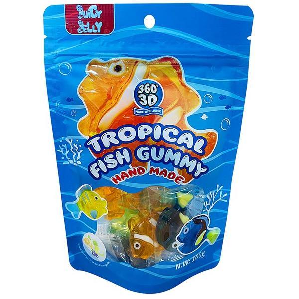A blue resealable bag of Twice as Sweet Juicy Jelly 3D Gummy Tropical Fish 100g (China) displays colorful cartoon fish and clear packaging, showing assorted tropical fish gummies inside. The label reads “Juicy Jelly 3D Gummy Tropical Fish.”.