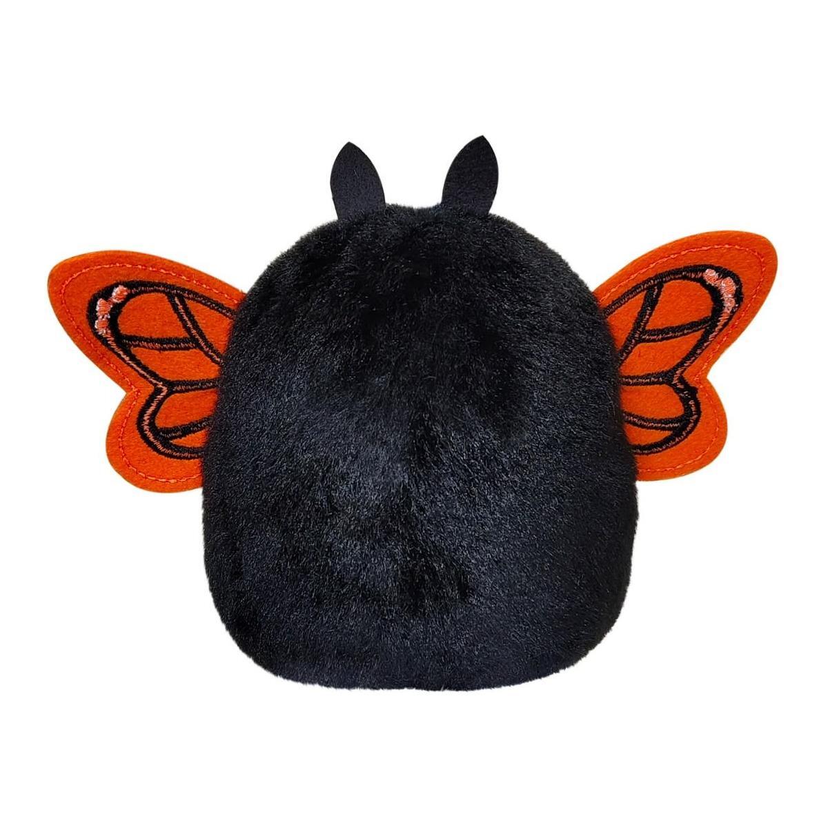 The Twice as Sweet Palm Pal Reyna Monarch Butterfly is a plush toy with black fur, two small black ears, and vibrant pink and black monarch wings on its back.
