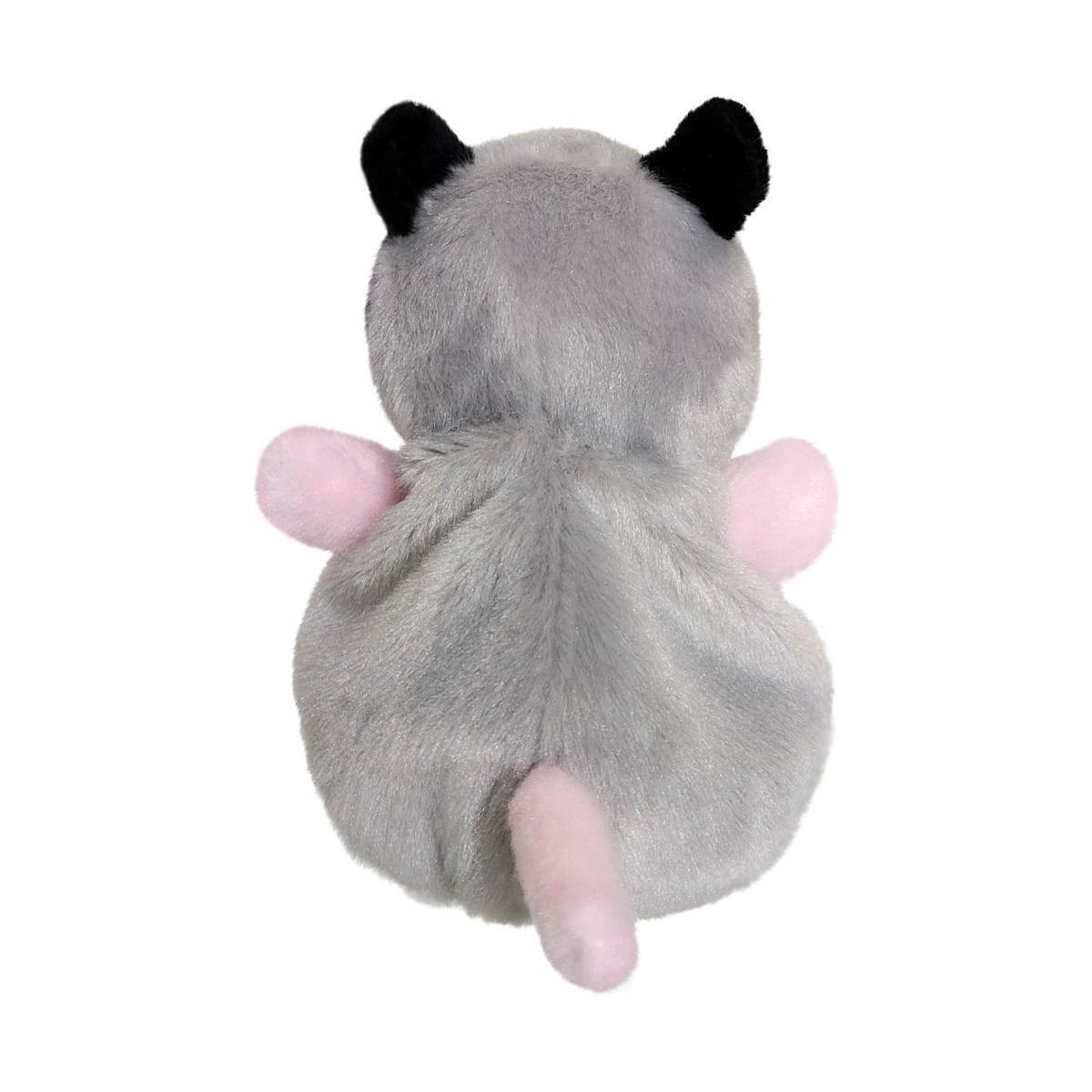 Meet Palm Pal Sherri Opossum by Twice as Sweet—a plush opossum toy with gray fur, black ears, and pink arms and tail, shown from the back against a white background. Perfect for playful, mischievous moments!.