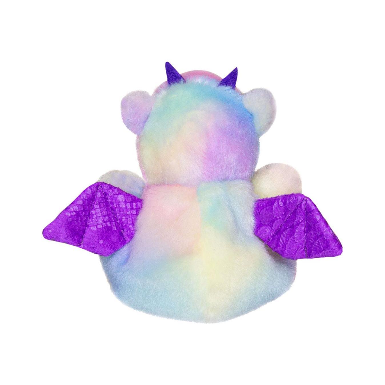 The Twice as Sweet Palm Pal Aster Dragon is a plush toy from the Palm Pals collection, featuring pastel rainbow fur, purple wings, and two purple horns, pictured from the back on a white background.