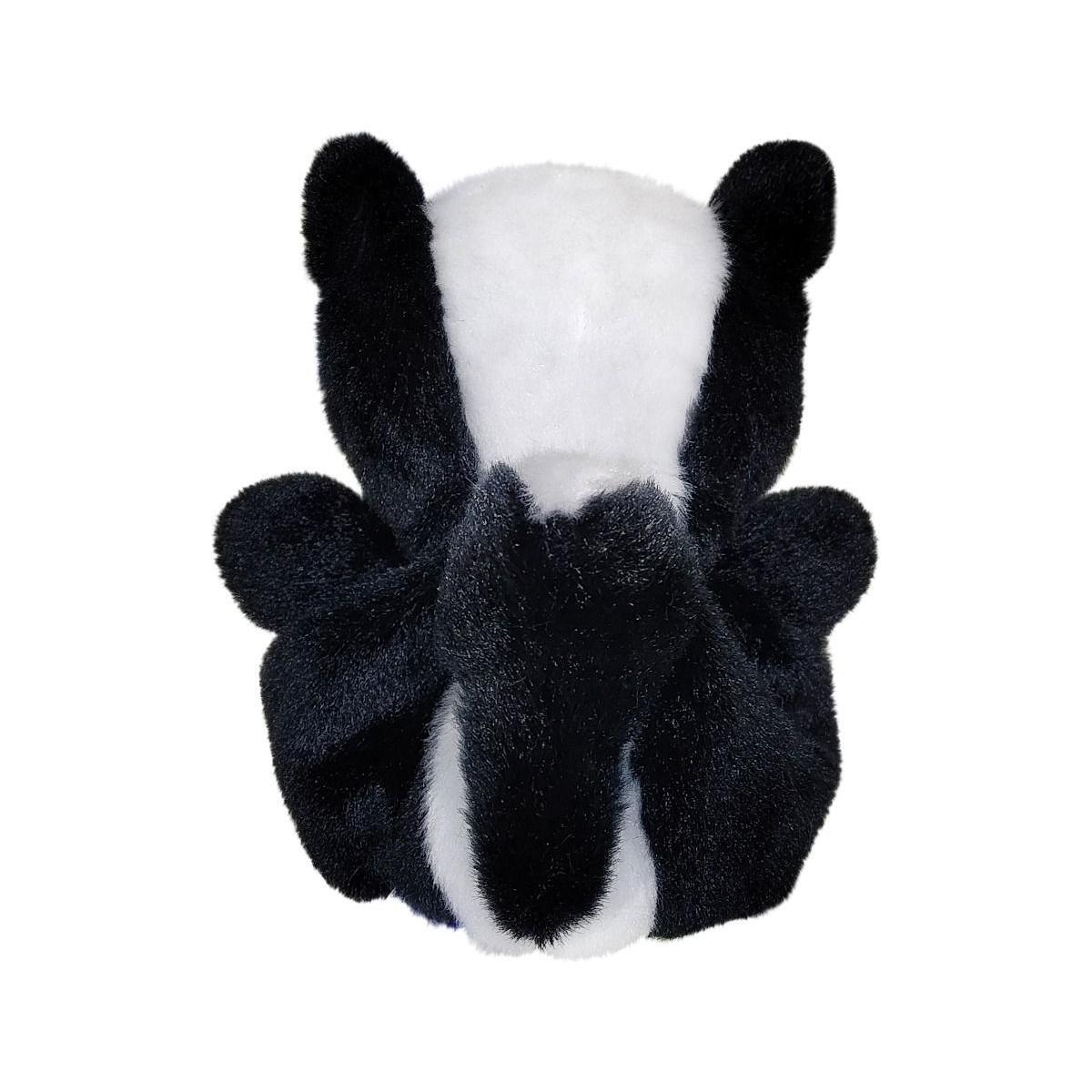 The Twice as Sweet Palm Pal Scout Skunk plush, designed to look like a black and white skunk, is shown from behind with its small ears, bushy tail, and paws visible against a clean white background.