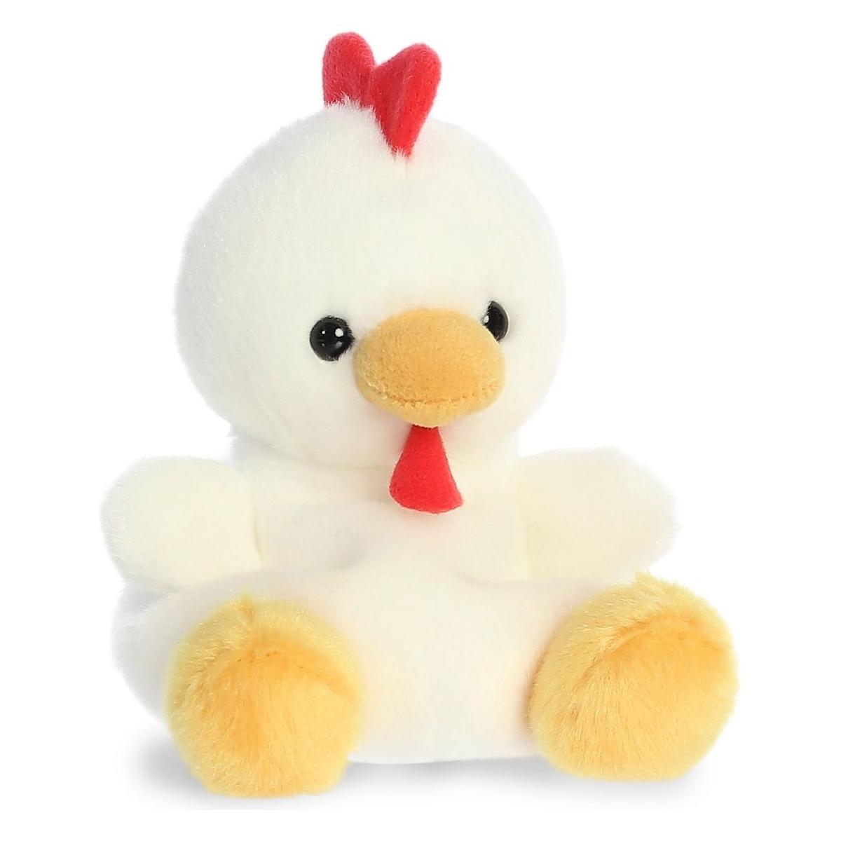 The Twice as Sweet Palm Pal Cooper Chicken is a fluffy white plush with yellow feet and beak, black eyes, a red comb, and a small red wattle beneath its beak, pictured sitting on a white surface.