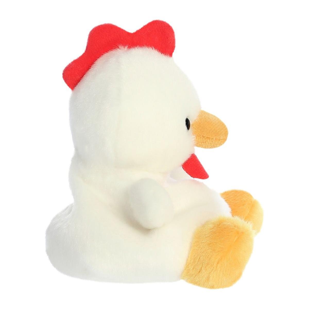 The Twice as Sweet Palm Pal Cooper Chicken, a plush toy with a fluffy white body, red comb, yellow beak, orange feet, and black eyes, is displayed from the side against a white background.