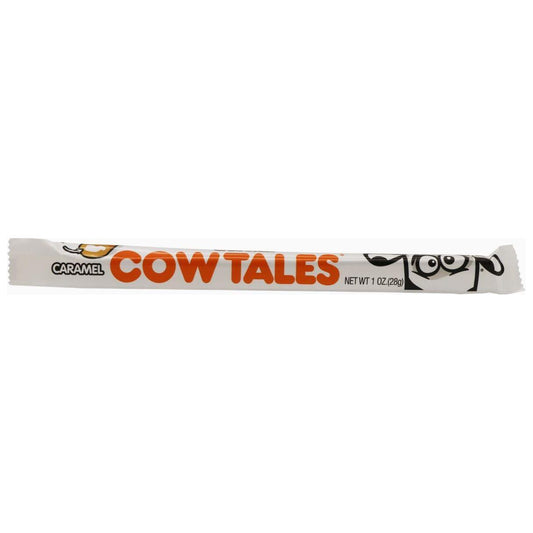 The Cow Tales Caramel 28g (USA) from Twice as Sweet is a chewy candy stick in a white wrapper with orange text, a cartoon cow face, and product info.