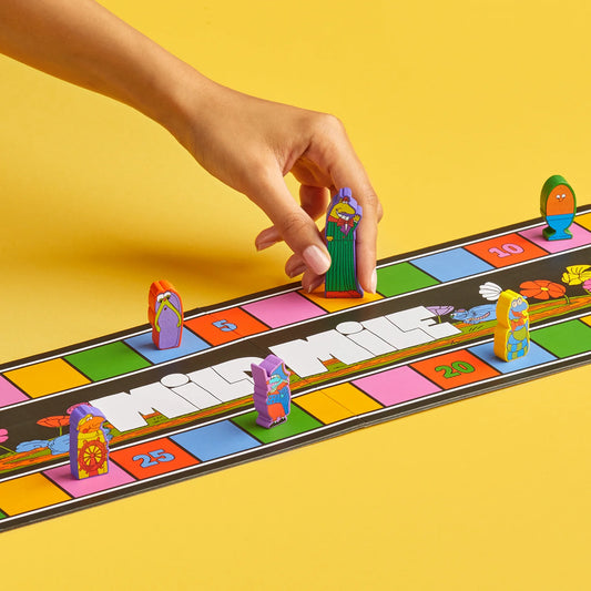 Colorful board game called Magical Athlete with player tokens on a yellow background