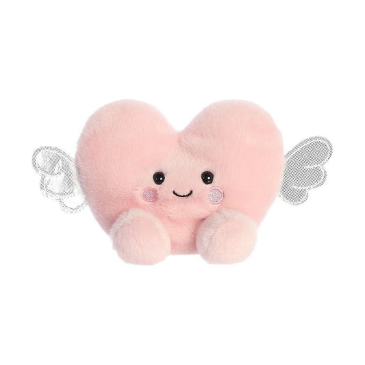 The Twice as Sweet Palm Pal Bliss Heart is a plush pink heart with rosy cheeks, a smiling face, small arms, and white wings—perfect for Valentine’s Day. Shown on a white background.