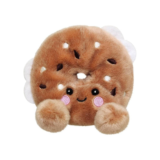 Palm Pal Tony Everything Bagel by Twice as Sweet is a plush toy styled as an everything bagel with a cute embroidered face, pink cheeks, and fluffy paws—perfect for adding charm to any collection. Background is plain white.