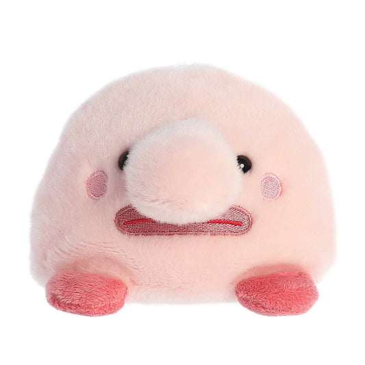 The Palm Pal Bart Blobfish by Twice as Sweet is a pink, round plush with a big nose, tiny black eyes, rosy cheeks, and two red feet—an adorable aquatic stuffed animal made of soft, fuzzy fabric.