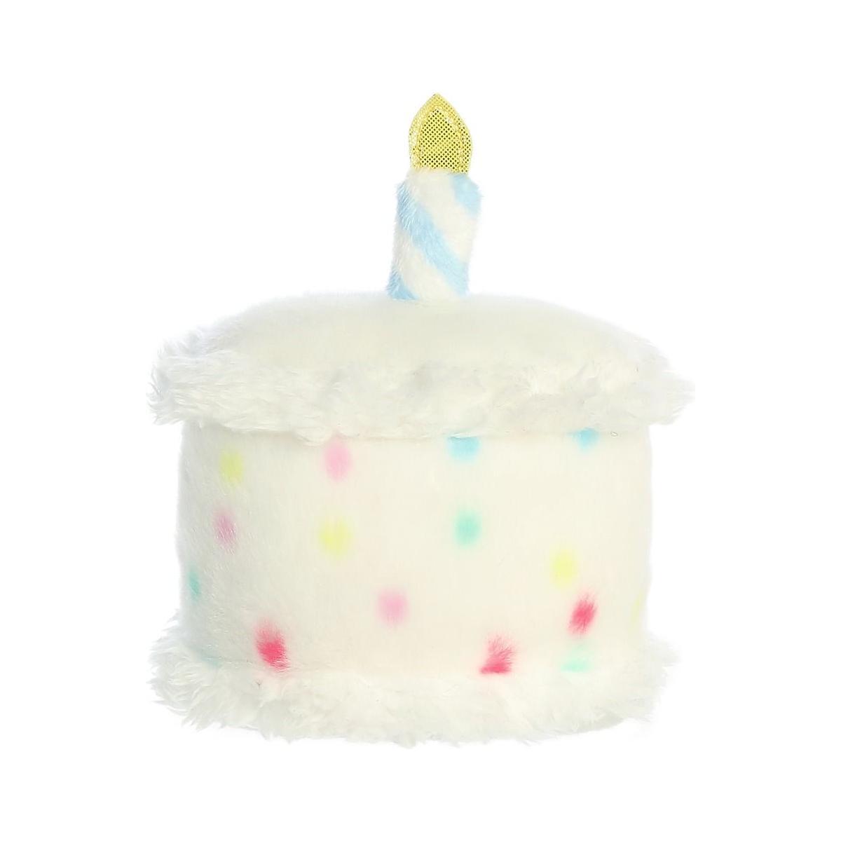 The Twice as Sweet Palm Pal Happy Bday Cake is a plush toy shaped like a cake, featuring white fuzzy frosting, colorful polka dots, and a blue-and-white striped candle with a yellow flame.