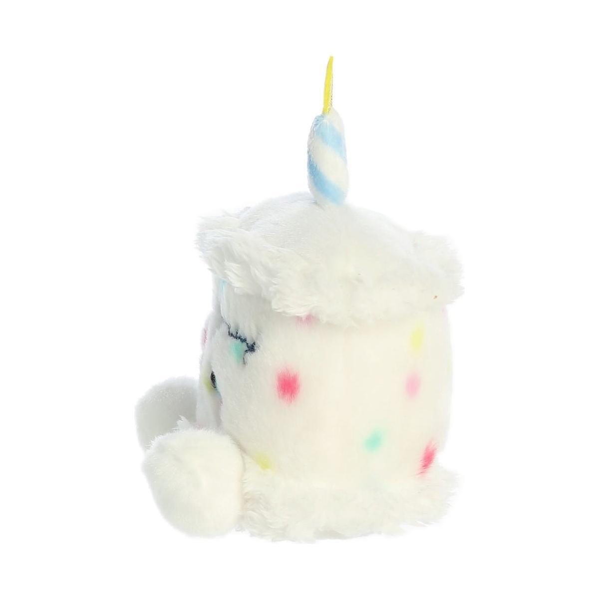 The Twice as Sweet Palm Pal Happy Bday Cake is a white frosted cupcake plush with multicolored dots, fluffy edges, stubby limbs, and a blue-striped candle—perfect for any celebration.
