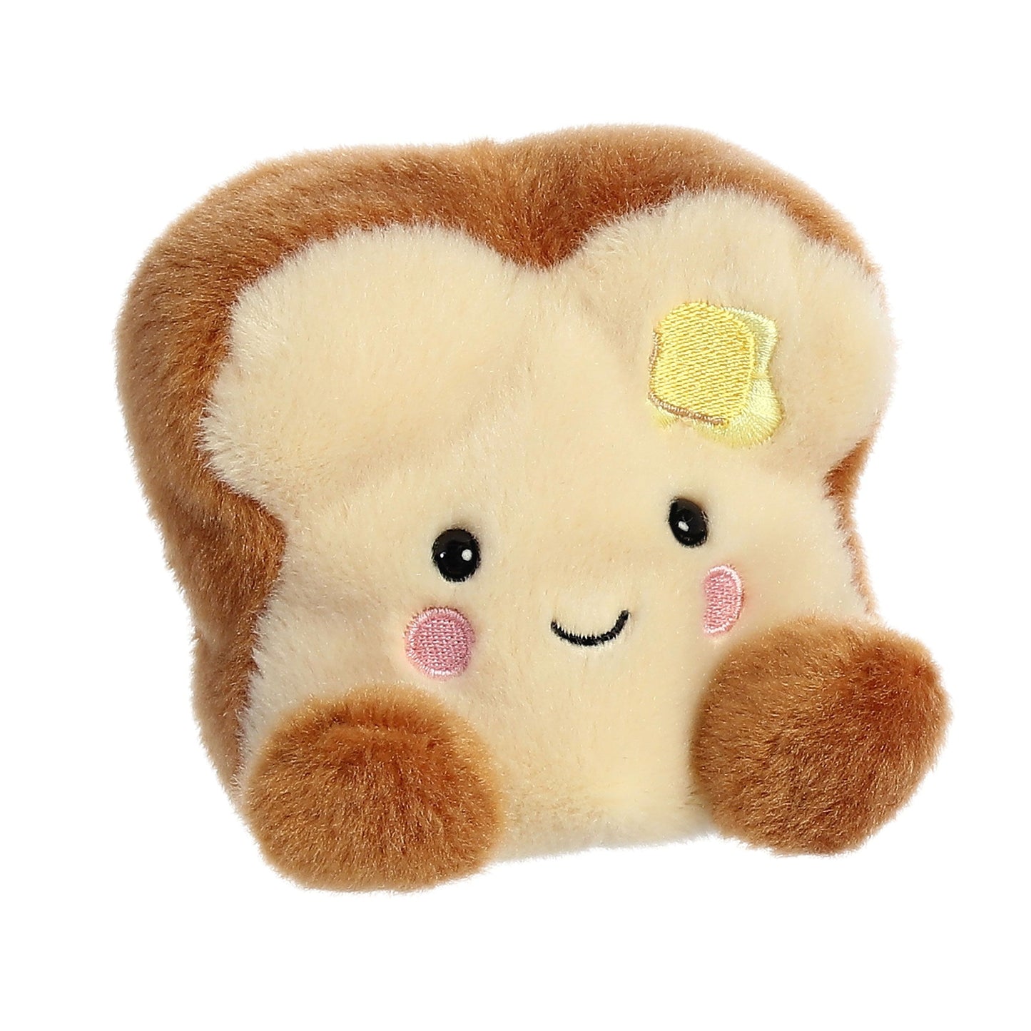 The Twice as Sweet Palm Pal Buttery Toast is a palm-sized, soft plush shaped like a smiling bread slice with pink cheeks and a yellow butter patch, featuring brown and cream colors—perfect as a cute breakfast-themed toy.