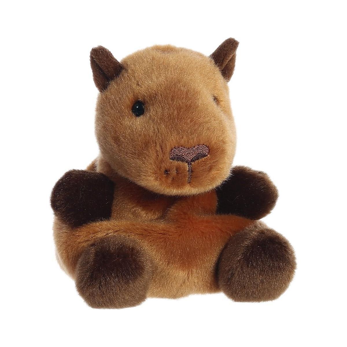 Palm Pal Sid Capybara by Twice as Sweet is a soft, brown plush toy with dark brown paws, small rounded ears, and a stitched nose. This adorable stuffed animal sits upright against a plain white background.