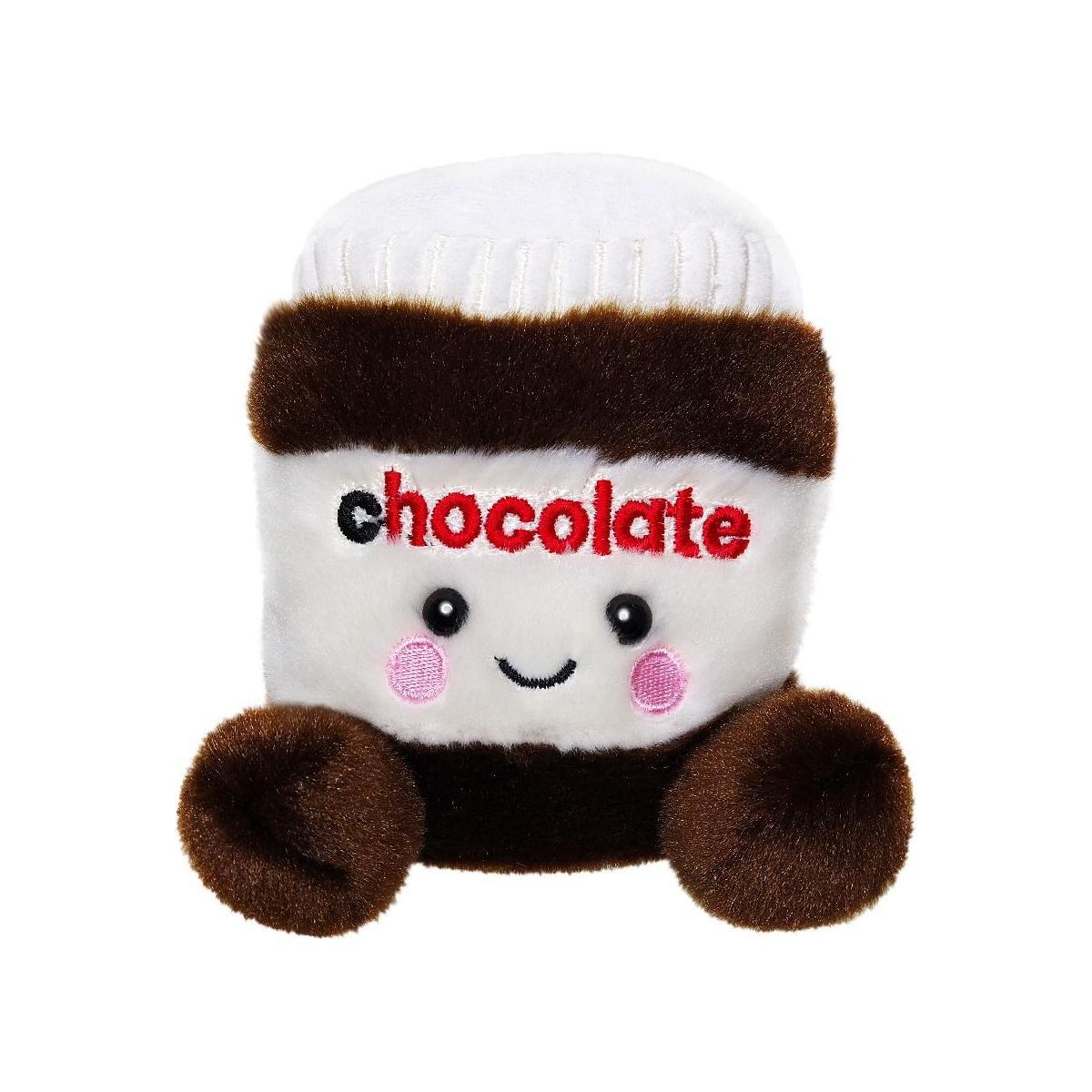 The Twice as Sweet Palm Pal Silky Chocolate Spread is a plush toy shaped like a jar with a white lid, brown and white body, embroidered chocolate text, rosy cheeks, a smiley face, and fuzzy round feet and hands.