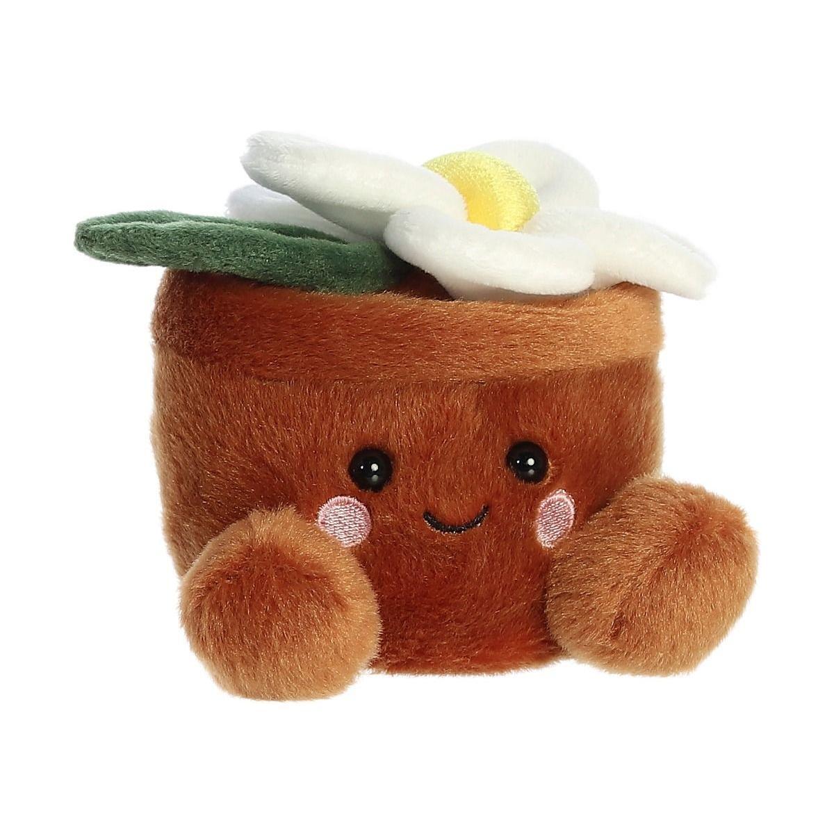 The Twice as Sweet Palm Pal Junie Daisy is a plush toy shaped like a brown flower pot with a smiling face, pink cheeks, fuzzy feet, and a soft daisy on top—perfect for whimsical party decor. Shown on a white background.