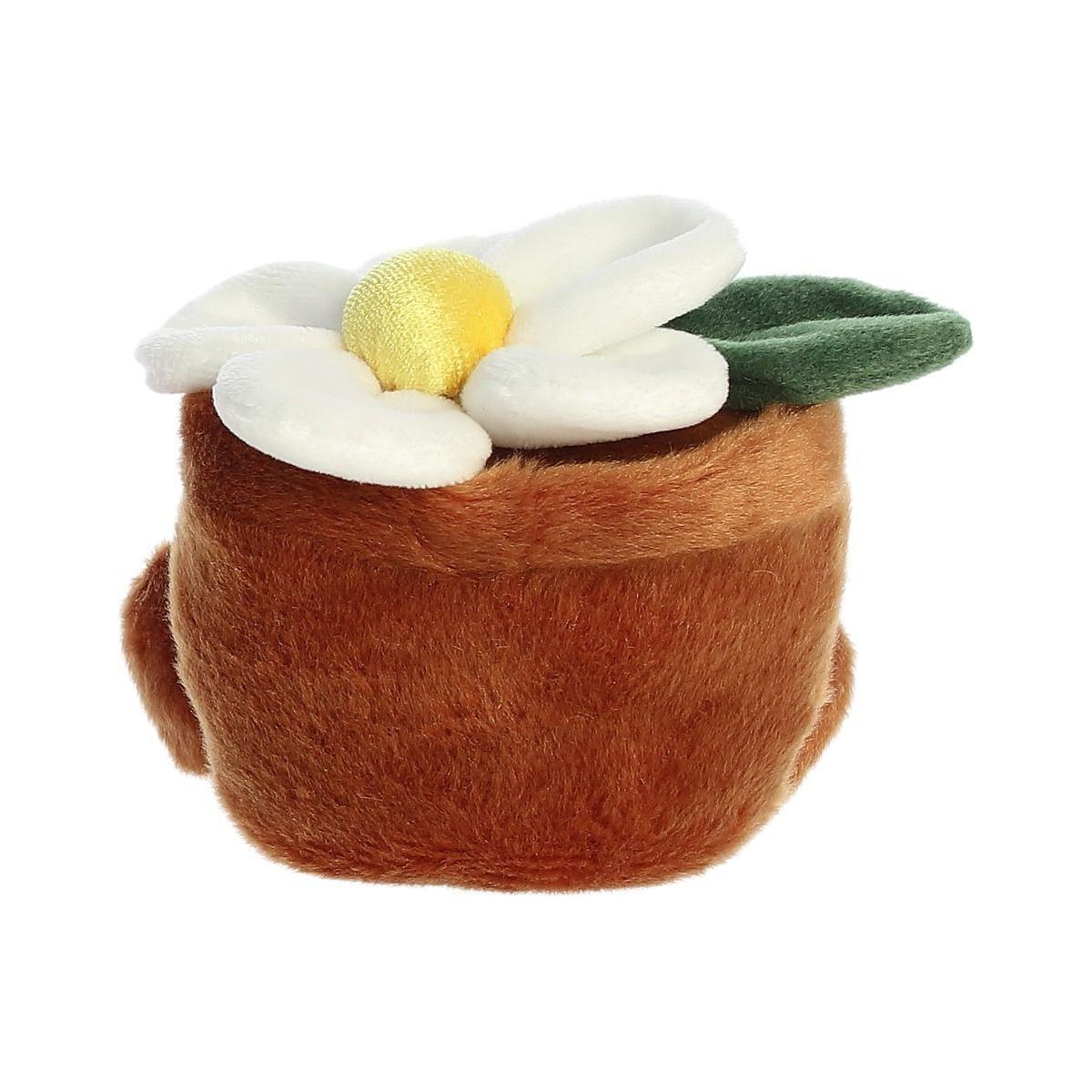 The Twice as Sweet Palm Pal Junie Daisy is a plush toy shaped like a brown flowerpot with a soft white and yellow daisy and green leaves, perfect for whimsical party decor. Shown against a white background.