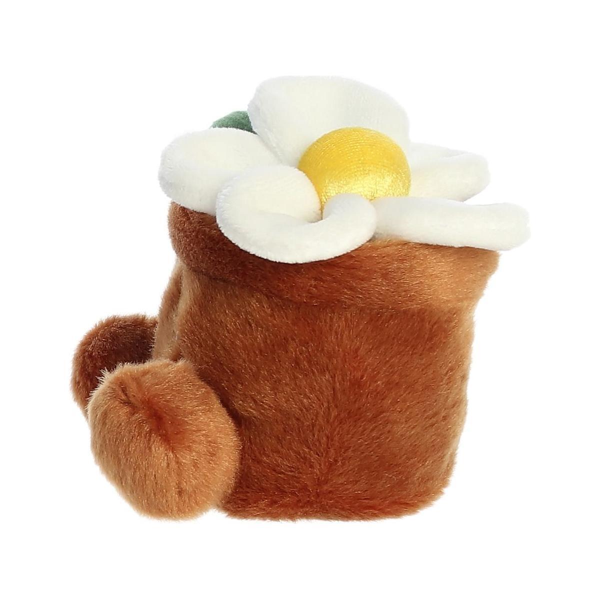The Twice as Sweet Palm Pal Junie Daisy is a plush toy shaped like a fuzzy brown pot with a white and yellow flower, soft velvety texture, and two round side feet—ideal as whimsical party decor or a cuddly companion.