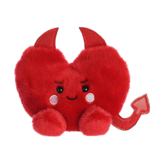The Twice as Sweet Palm Pal Klaus Heart is a plush red heart with devil horns, a smiling face, blushing cheeks, and a soft pointed tail—perfect as a unique Valentines Day devil horn stuffed animal gift.