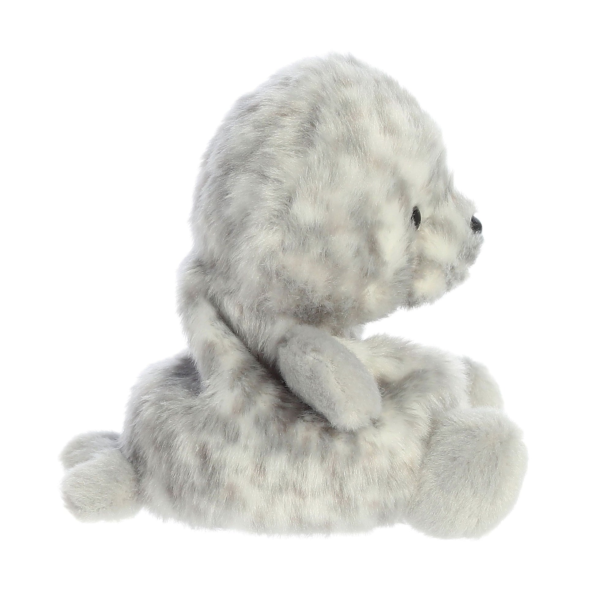 The Twice as Sweet Palm Pal Marina Harbour Seal is a soft, gray and white spotted plush baby seal, shown in profile sitting upright with flippers out and small black eyes.