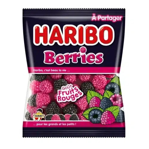 A 100g bag of Twice as Sweet Haribo Berries (France) with pink and black berry gummies visible through clear packaging. The dark blue label features Berries in pink and images of French gummies at the bottom.