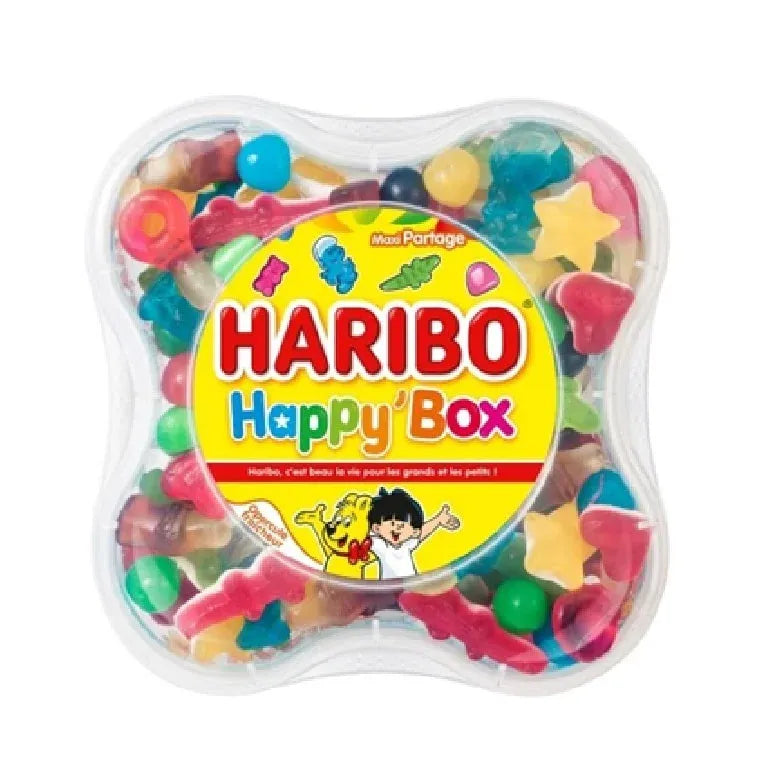 The Twice as Sweet Haribo Happy Box 600g (France) is a plastic container filled with colorful, fun-shaped Haribo gummies. The bright lid features cartoon mascots and playful text for a delightful gummy candy experience.