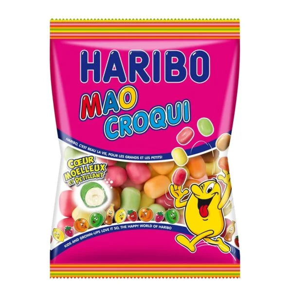 A colorful bag of Twice as Sweet Haribo Mao Croqui 250g (France) BB:11/25 sits on a pink background, showing assorted chewy candies through a clear window and featuring a waving yellow cartoon character on the packaging.