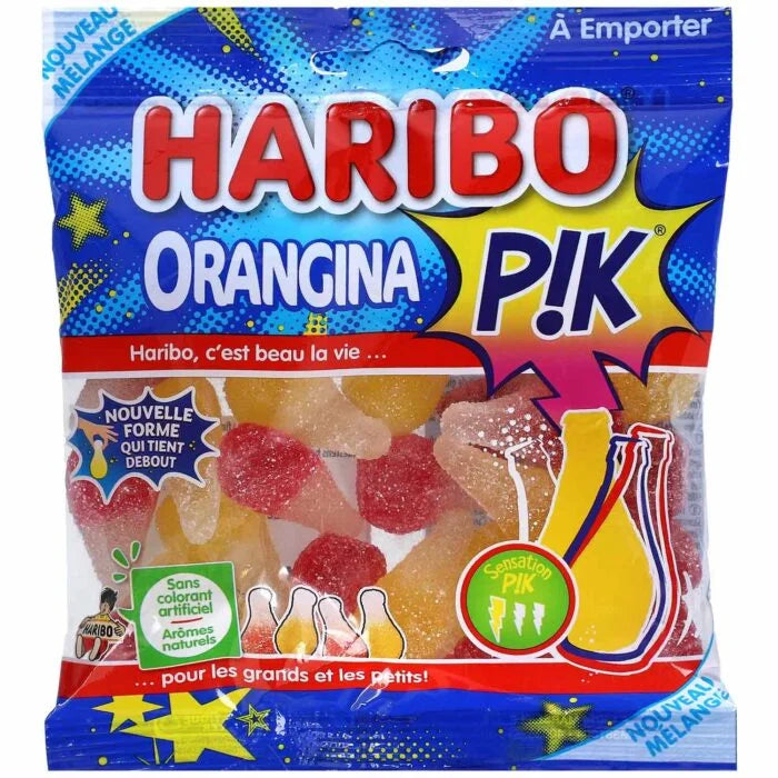 A 250g bag of Twice as Sweet Haribo Orangina Pik from France, with bright yellow, red, and orange packaging decorated with citrus shapes and bottles, features bold French text highlighting its tangy citrus flavor.