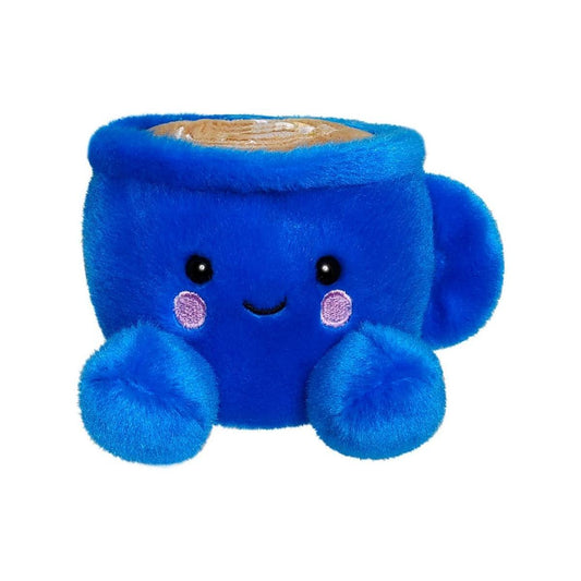 Meet Palm Pal Letti Latte by Twice as Sweet—a plush blue coffee mug with a smiling face, rosy cheeks, fuzzy feet, and tan plush on top to resemble a frothy drink.