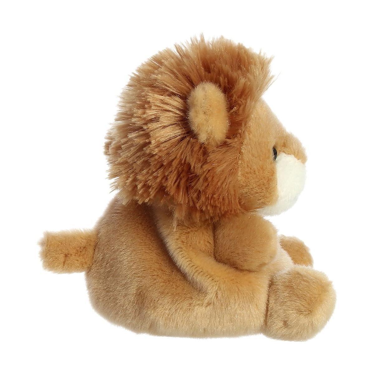A side view of the Palm Pal Leno Lion plush by Twice as Sweet, featuring a soft brown body, fluffy mane, round ears, and small tail—ideal for zoo party themes or cuddling, shown sitting upright against a white background.
