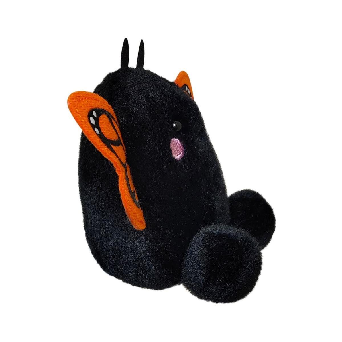 The Twice as Sweet Palm Pal Reyna Monarch Butterfly is a plush toy with orange and black patterned wings, small antennae, round black feet, and a cute face with a pink cheek, shown sitting on a white background.