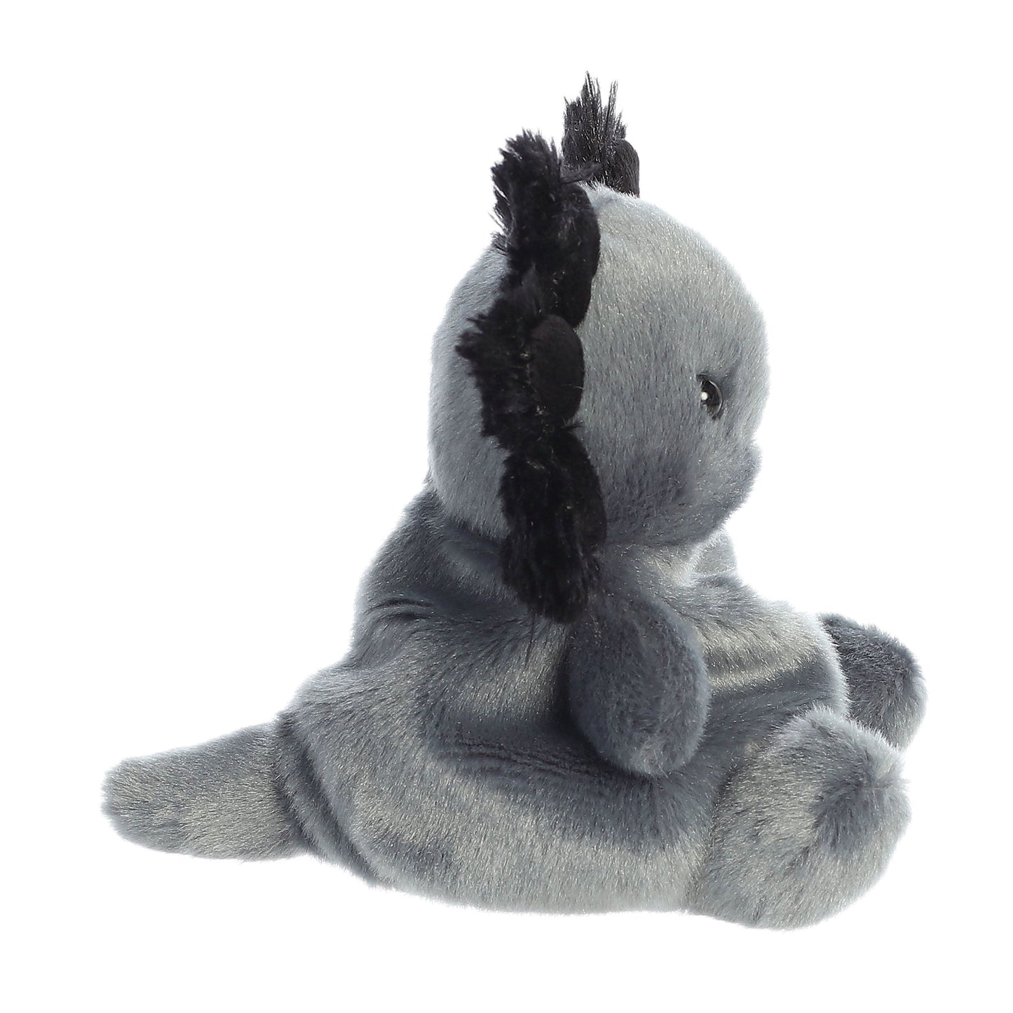 A soft, gray Palm Pal Onyx Axolotl plushie from Twice as Sweet is shown sitting upright, viewed from the side—part of the charming Palm Pals collection.