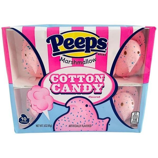 A box of Twice as Sweet Peeps Cotton Candy Chicks (10 Count, 85g, USA) features pink marshmallow chicks with blue speckles and a cotton candy flavor in bright pink-and-blue striped packaging with cartoon cotton candy and nutrition info.