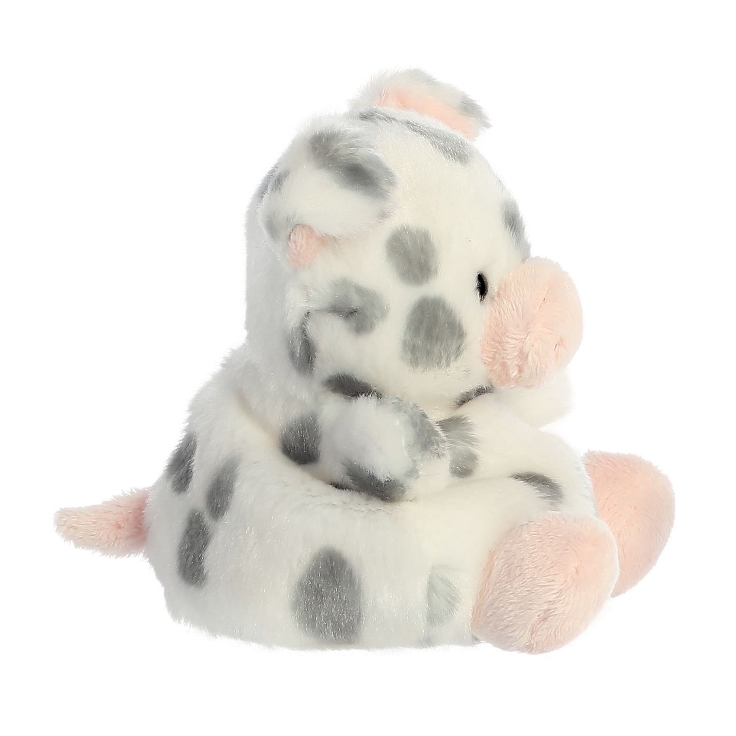 The Twice as Sweet Palm Pal Piggles Spotted Piglet is a palm-sized plush toy with white fur, gray spots, and pink snout, ears, and feet. It sits upright and faces sideways against a white background.