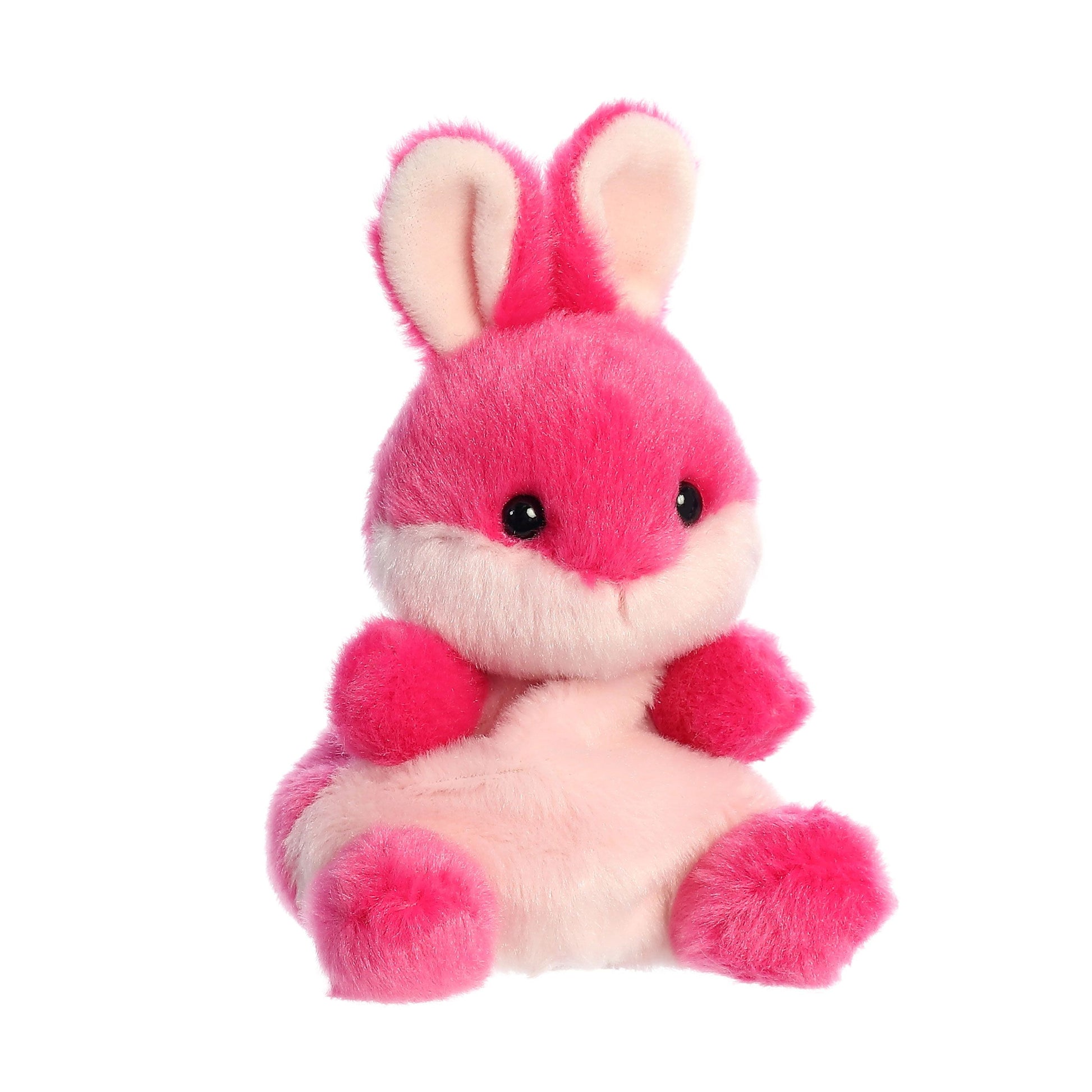 The Twice as Sweet Palm Pal Pixie Pink Bunny is a plush pink and white stuffed animal with large ears, black eyes, and a soft, fluffy texture, shown sitting upright on a white background.