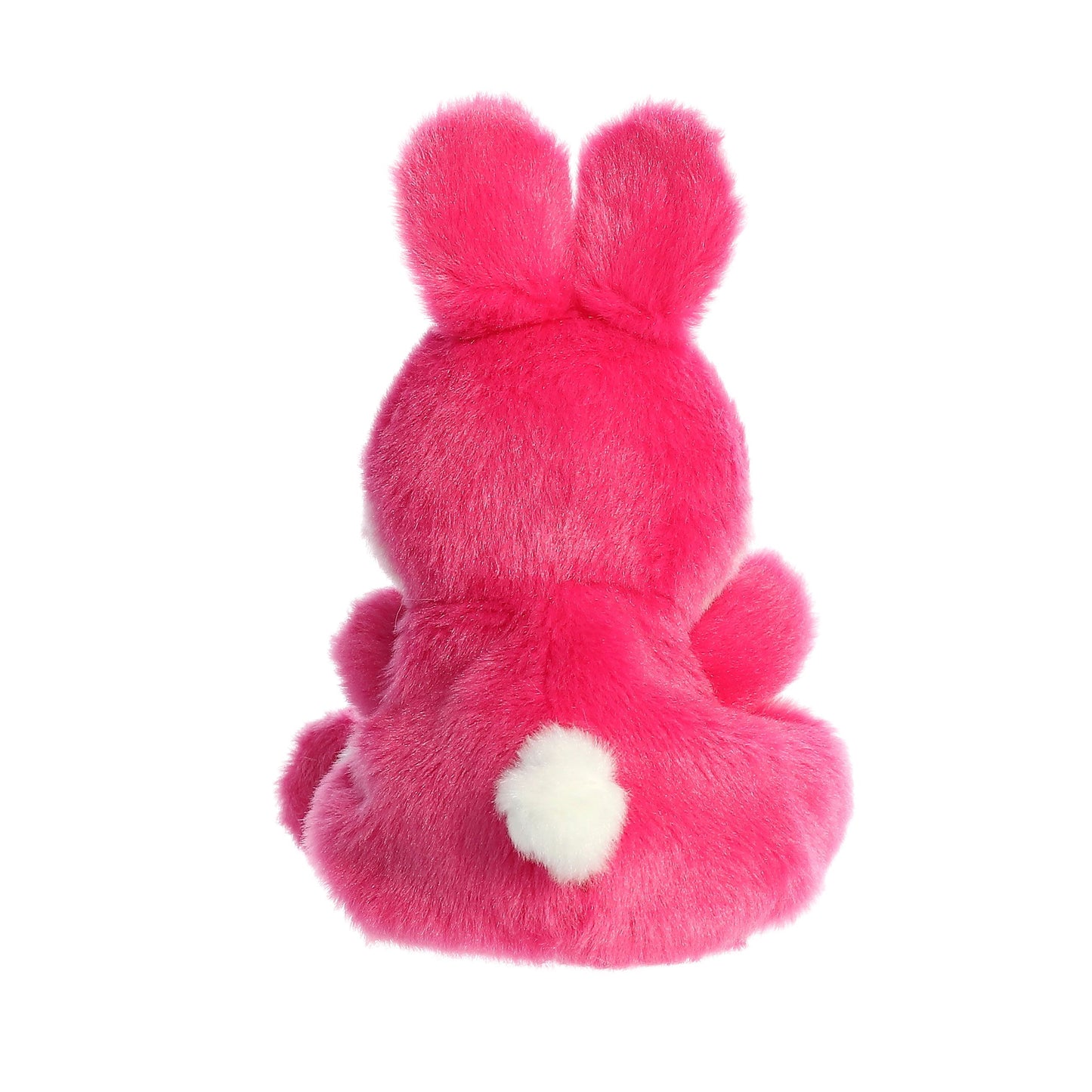 The Twice as Sweet Palm Pal Pixie Pink Bunny sits with its back to the camera, displaying upright ears and a fluffy white tail—a charming addition to any plush collection.