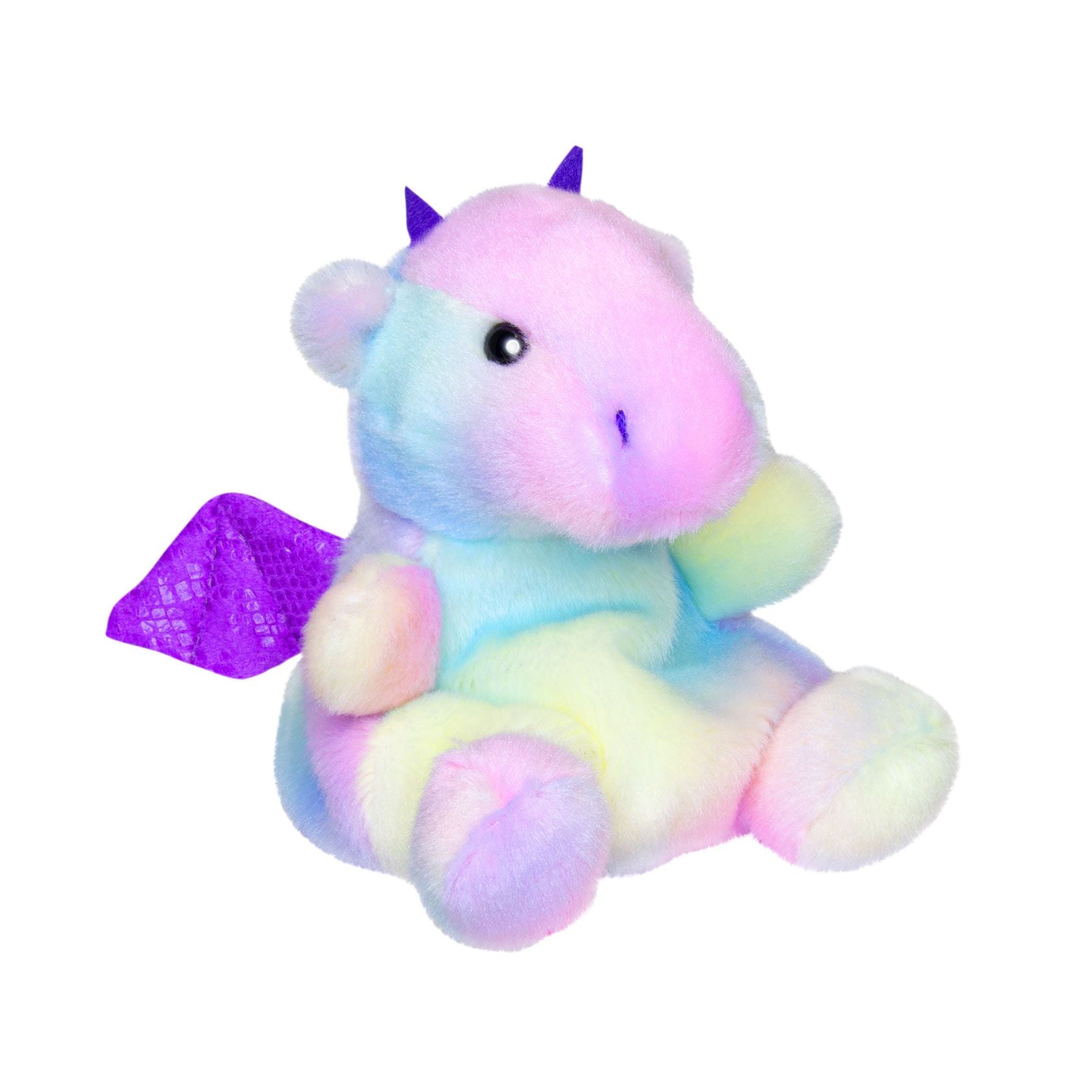 The Twice as Sweet Palm Pal Aster Dragon plushie features a pastel rainbow body, shiny purple wings and horns, black eyes, and sits upright on a white background.