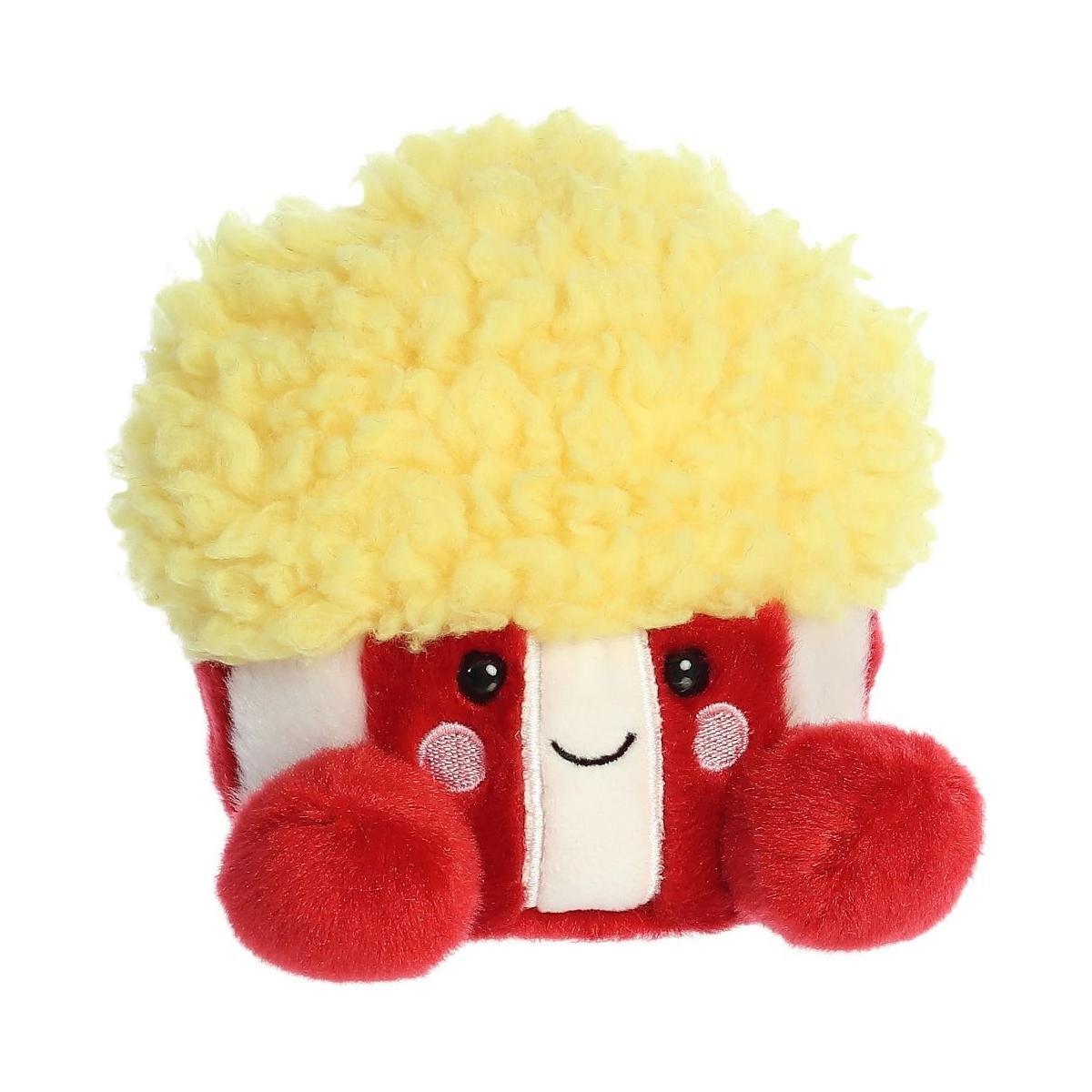The Twice as Sweet Palm Pal Butters Popcorn is a plushie shaped like a box of popcorn with a fluffy yellow top, red and white striped base, cute red feet, and a smiling face—perfect for movie marathons or as an adorable popcorn stuffed toy.