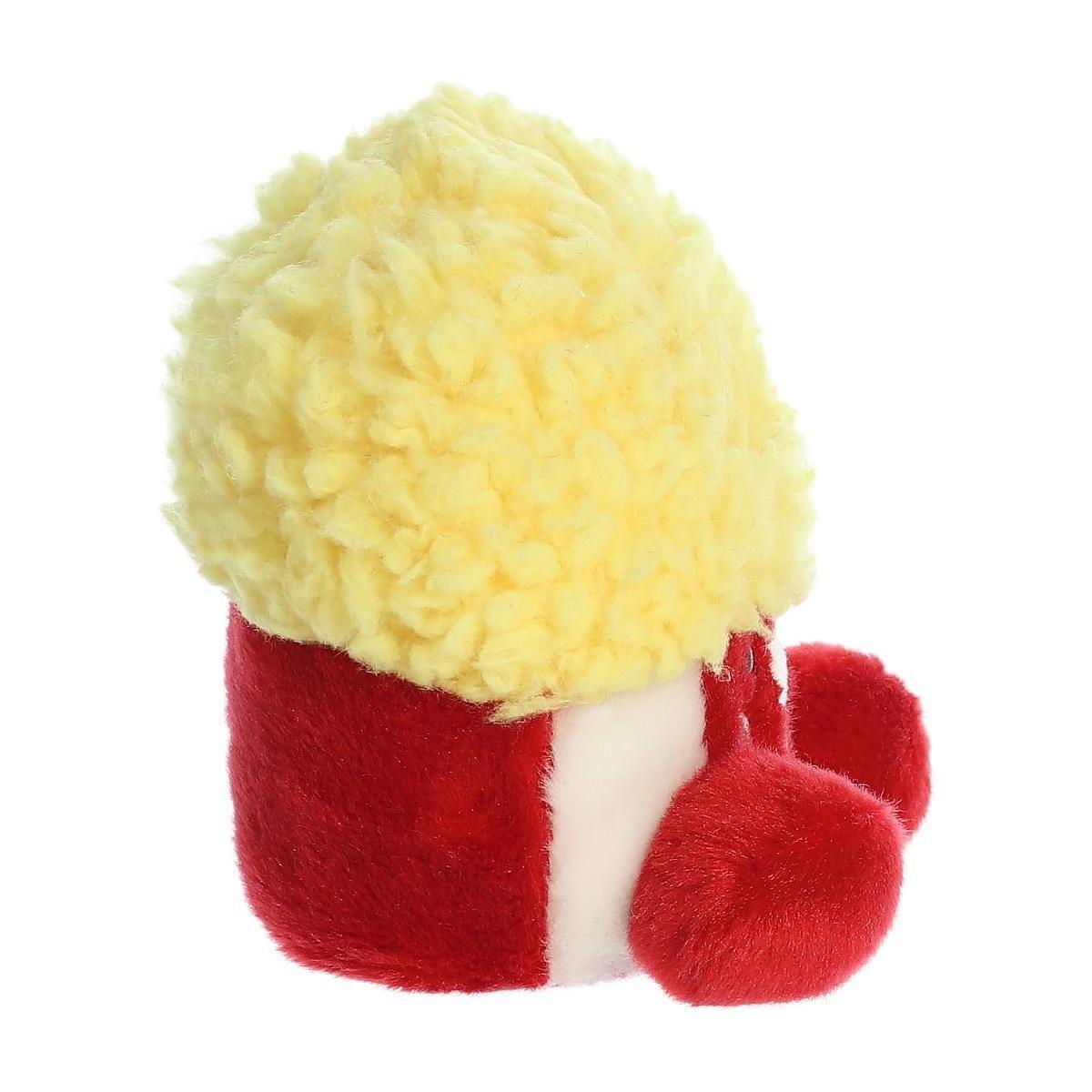 Palm Pal Butters Popcorn by Twice as Sweet is a quirky plush toy shaped like popcorn in a red box with fluffy yellow puffs and round red feet—perfect for movie lovers or anyone who adores unique stuffed animals.