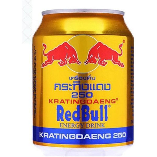 A gold can of Twice as Sweet RedBull Original 250mL (Thailand) shows two red bulls charging, Red Bull branding in English and Thai, and a blue stripe at the bottom with KRATINGDAENG 250 and energizing caffeine.