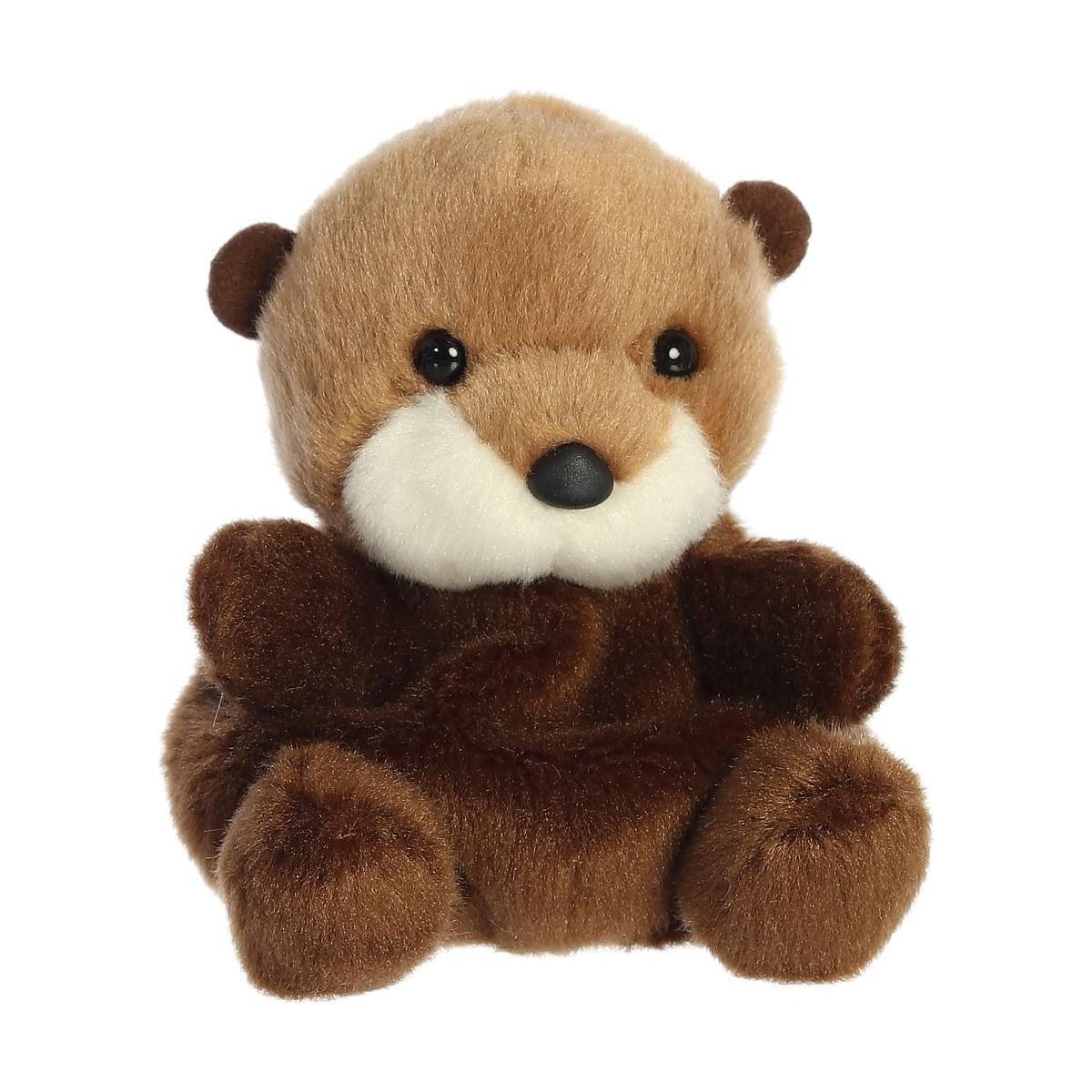 The Twice as Sweet Palm Pal Selena Sea Otter plush toy features soft brown fur, a white snout, round black eyes, and a dark brown nose. Sitting upright against a white background, shes ready for any aquatic adventure.