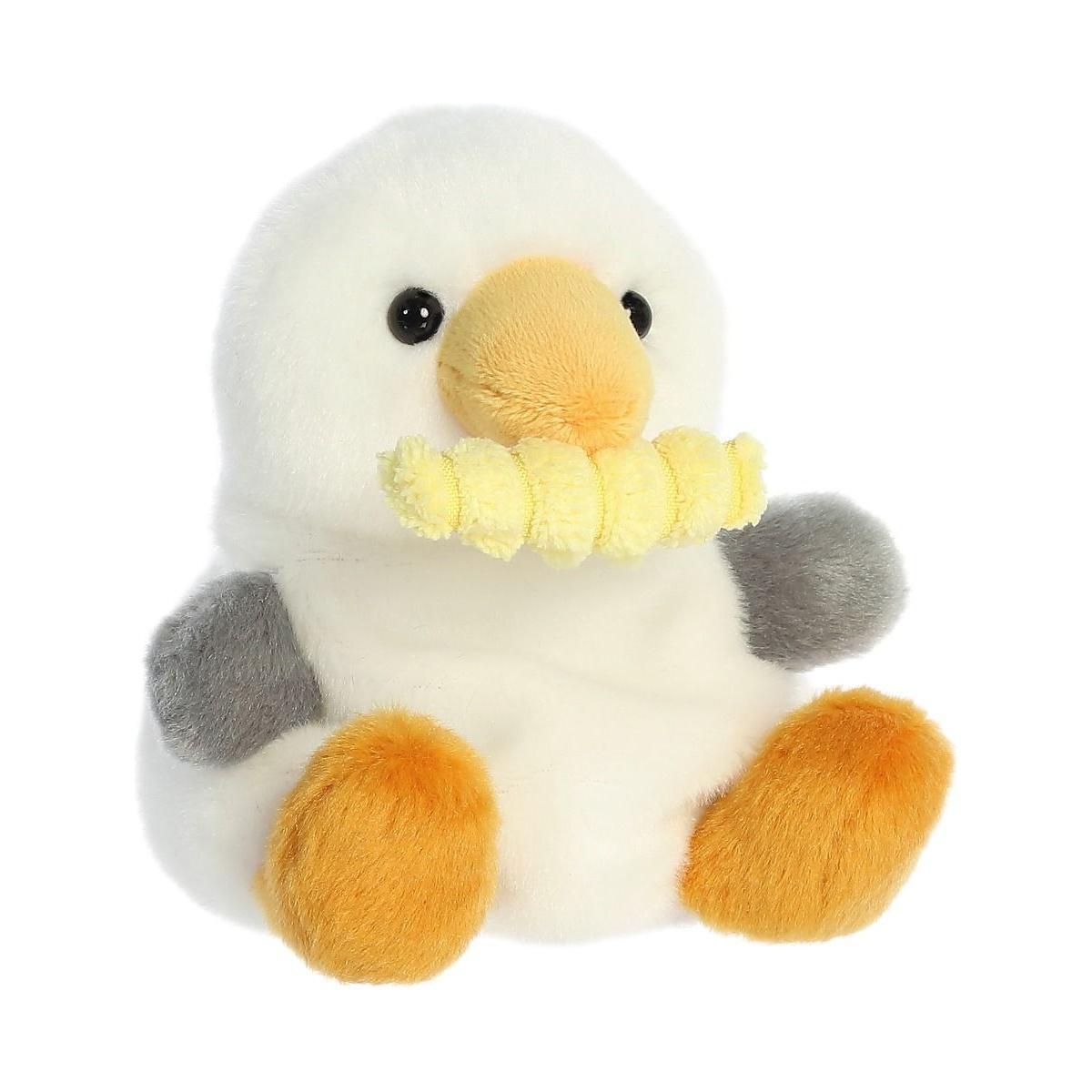 The Twice as Sweet Palm Pal Buoy Seagull with Fry is a plush white bird toy with orange feet, yellow beak, gray wings, and a crochet crinkle fry in its beak—ideal for beach picnic toy collections.