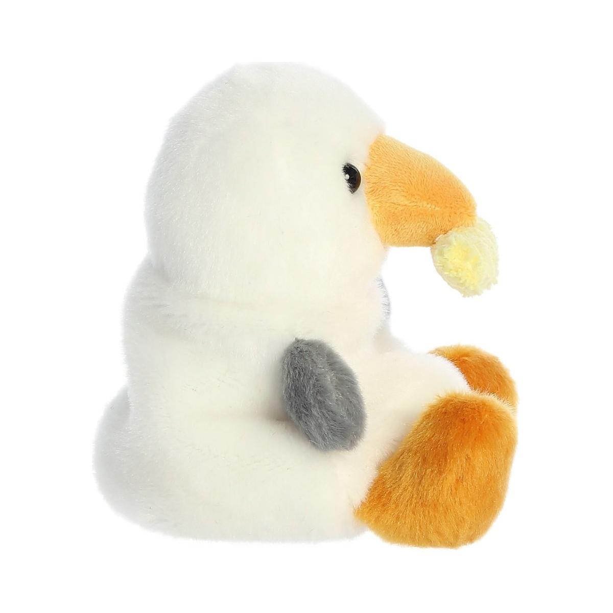 The Twice as Sweet Palm Pal Buoy Seagull with Fry is a plush white bird with an orange beak, grey wing, and orange feet—an adorable upright toy ideal for kids’ beach picnics.