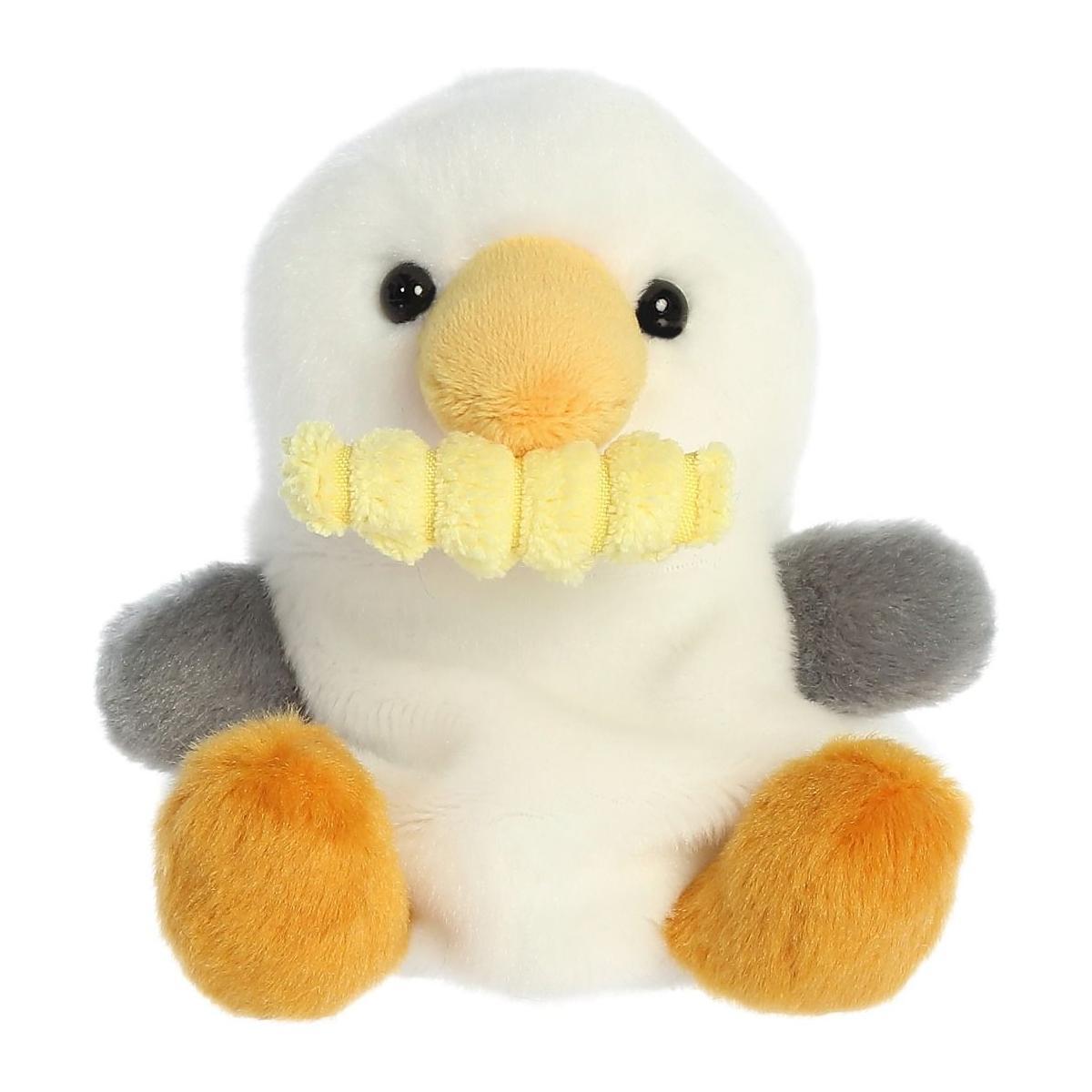 The Twice as Sweet Palm Pal Buoy Seagull with Fry is a plush white bird toy with orange and gray wings, orange beak and feet, plus a cheerful yellow smile—perfect for playful beach picnics.