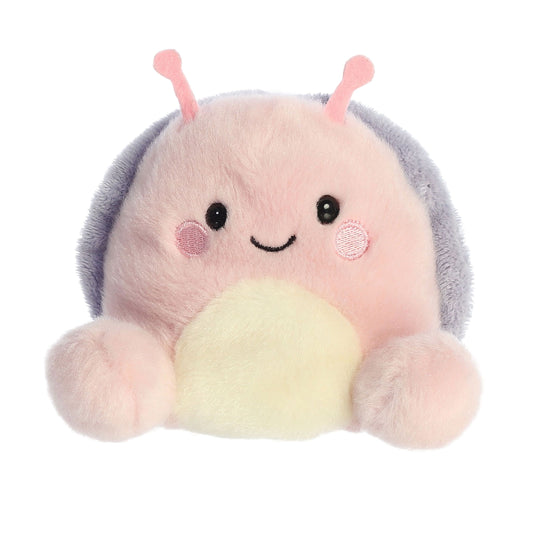 Meet the Palm Pal Shelby Snail by Twice as Sweet—a plush pink snail with a light yellow belly, gray shell, pink antennae, and a smiling face with rosy cheeks. The perfect introvert plush toy for cozy cuddles!.