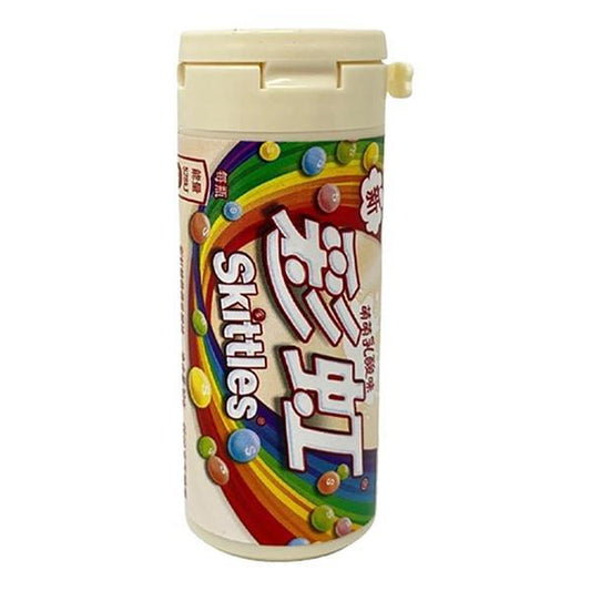 Skittles Tube Yoghurt 30g (China) by Twice as Sweet comes in a cylindrical container with a white lid, rainbow graphics, Skittles images, and English and Chinese text, making it a popular fruity snack in China.