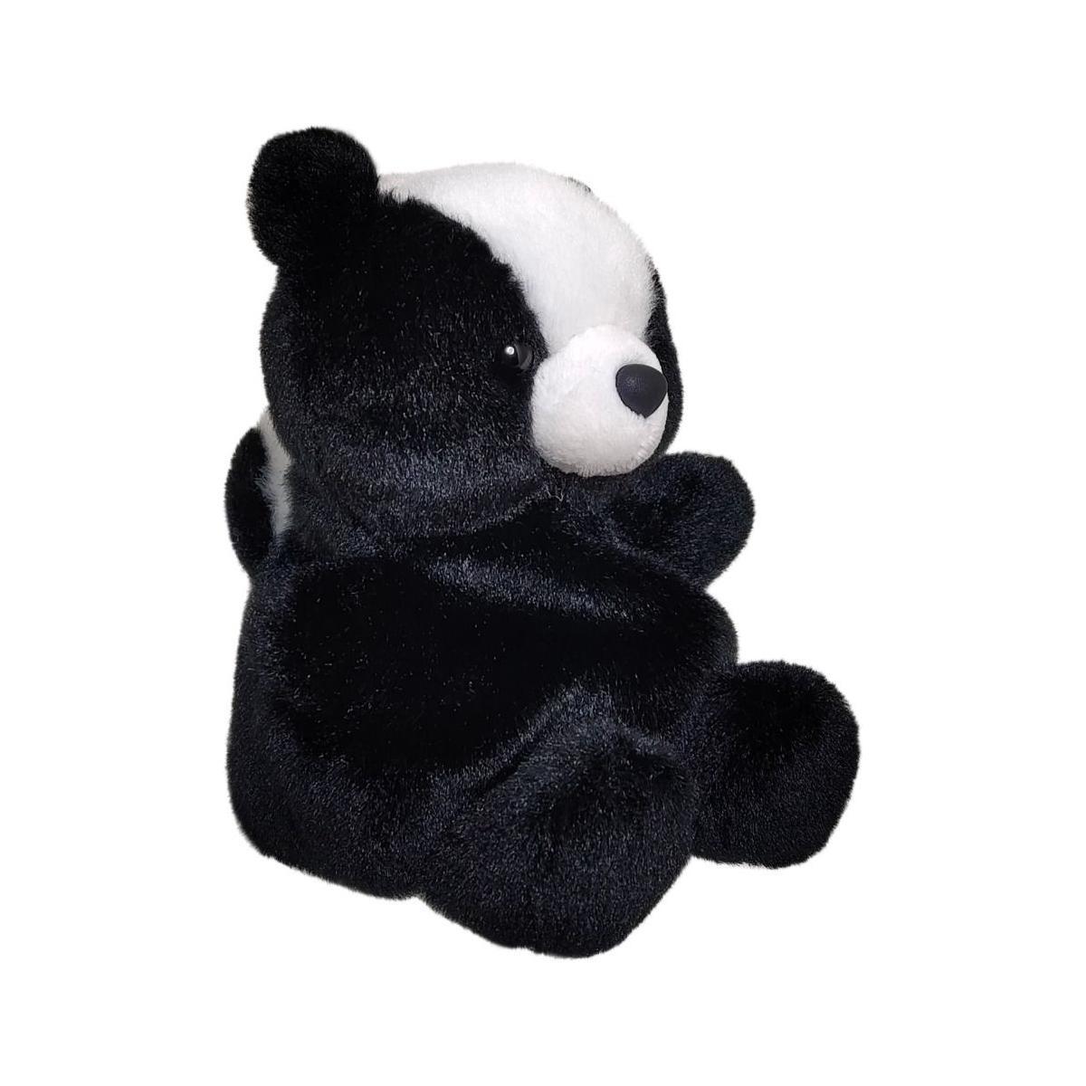 The Twice as Sweet Palm Pal Scout Skunk plush sits upright on a white background, showcasing soft, fuzzy black fur with a white face and stripe for an adorable look.
