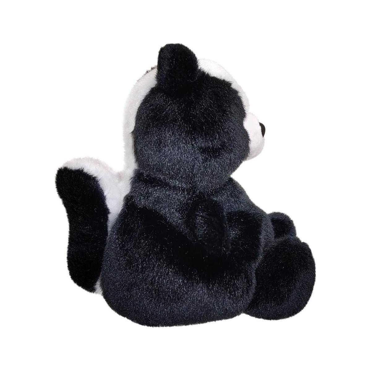 The Twice as Sweet Palm Pal Scout Skunk plush, featuring black fur and a white stripe on its back and head, sits upright facing right against a white background.