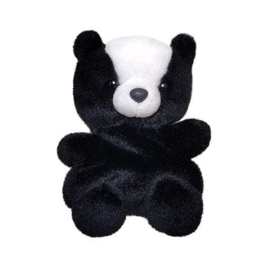 The Twice as Sweet Palm Pal Scout Skunk plush, featuring black fur, a white head patch, round ears, and a light grey snout, sits upright against a plain white background.