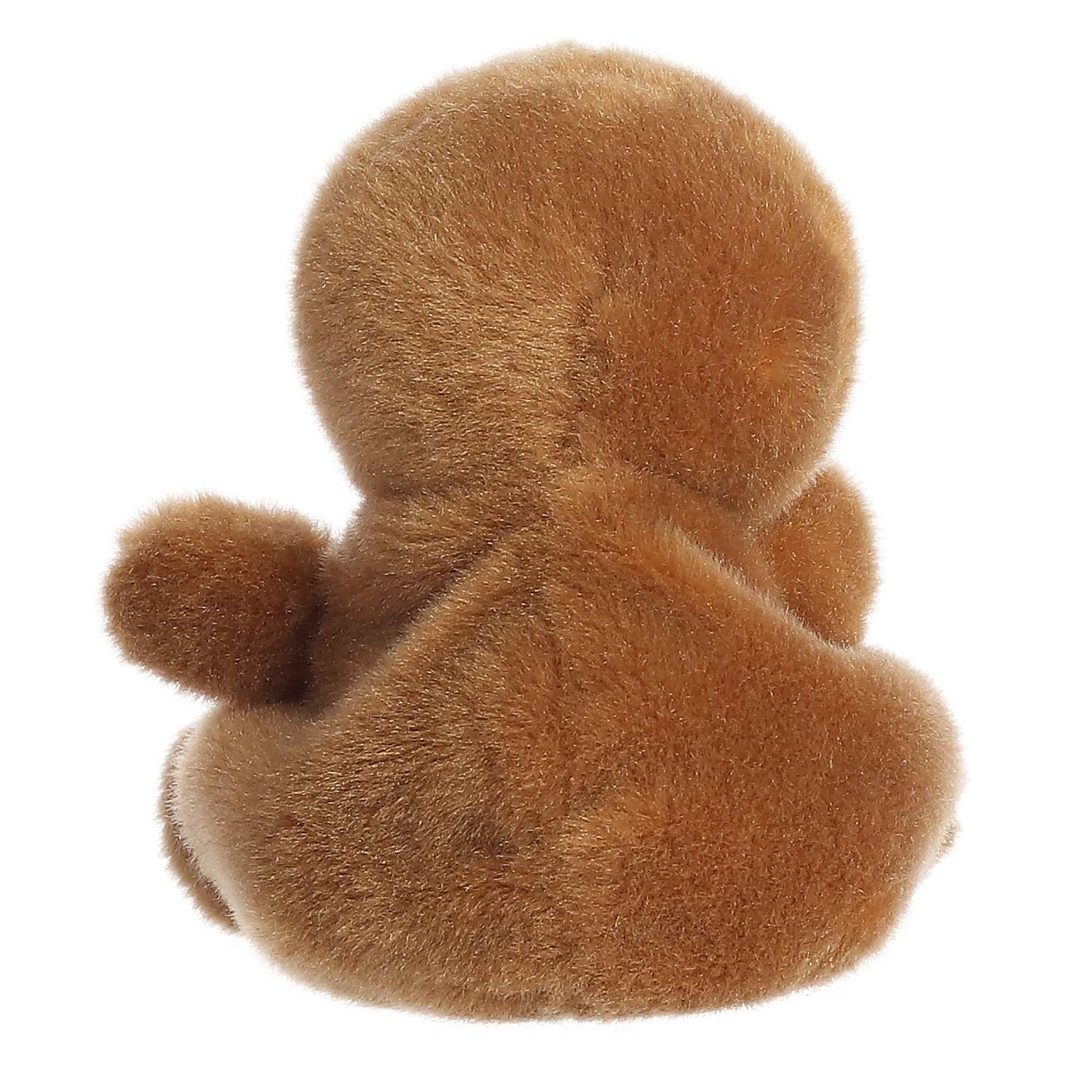 The Twice as Sweet Palm Pal Slomo Sloth is a soft, brown plush with a round head, small arm, and round body, shown from the back against a white background—ideal for cuddling or napping.
