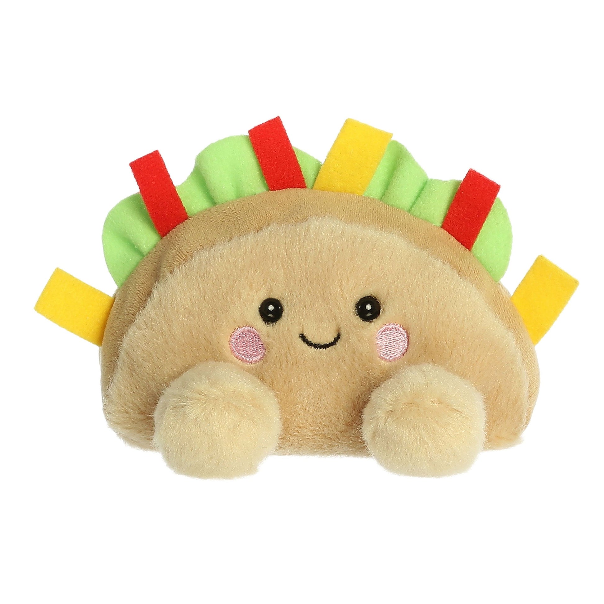 The Twice as Sweet Palm Pal Fiesta Taco is a colorful, soft plush shaped like a taco with a smiling face, pink cheeks, and green, red, and yellow felt toppings—perfect as a cheerful party companion!.